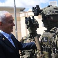 Prime Minister Benjamin Netanyahu, left, visit the undercover Border Police "Mista'arvim" unit, March 19, 2025. (Amos Ben Gershom/GPO)