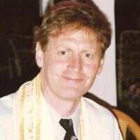 Jeffrey Klein leading the seder in 1990. (Courtesy of Klein Family)