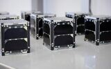 Small cube-shaped satellites built by Israeli students. (Ronen Horesh/GPO)