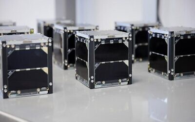 Small cube-shaped satellites built by Israeli students. (Ronen Horesh/GPO)