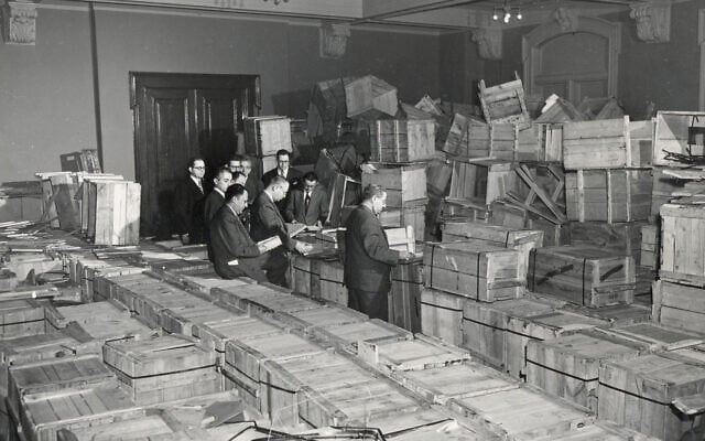 Leaders of the New York-based YIVO open crates of salvaged YIVO treasures from Europe, photographed in New Jersey, 1947. (Courtesy of the YIVO Institute for Jewish Research)