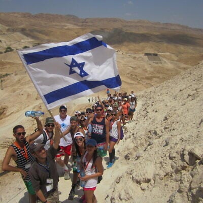 Young Jewish adults hike up Masada near the Dead Sea during their 10-day Birthright trip. (courtesy)