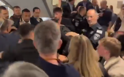 Violence erupts outside the Knesset plenum on March 3, 2025, as guards push away people including bereaved families trying to enter the spectators' gallery to watch the parliamentary debate on the establishment of a state commission of inquiry into the Hamas onslaught of October 7, 2023. (Screen capture: X/October Council, used in accordance with Clause 27a of the Copyright Law)