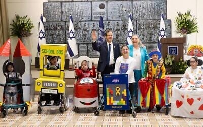 President Isaac Herzog made an unannounced appearance at a Jerusalem Purim party for children with disabilities, March 2025. (Deborah Danan via JTA)