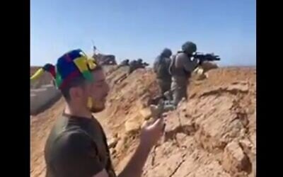Reservist soldiers are seen in a border buffer zone opening fire toward Gaza during a reading of the Book of Esther, March 14, 2025 (Social media)