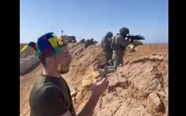Reservist soldiers are seen in a border buffer zone opening fire toward Gaza during a reading of the Book of Esther, March 14, 2025 (Social media) Reservist soldiers are seen in a border buffer zone opening fire toward Gaza during a reading of the Book of Esther, March 14, 2025 (Social media)