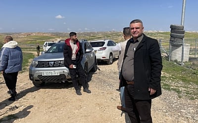 Khirbet Zanuta head Faez Tel and Palestinian activists arrive at the abandoned West Bank hamlet of Khirbet Zanuta, March 10, 2024. (Jeremy Sharon/Times of Israel)
