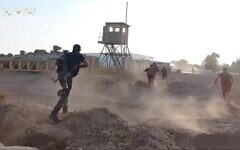 Hamas terrorists attack the IDF's Nahal Oz base on October 7, 2023, as seen in footage released by the terror group. (Screenshot: Telegram)