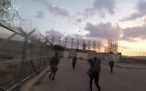Hamas terrorists attack an army base next to the Erez Crossing, on October 7, 2023, in footage released by the terror group. (Screenshot: Telegram)