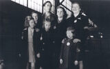 The seven Weber siblings upon their arrival at New York Harbor in May 1946. Bottom row from left: Renee, Judith, and Bela. Top row from left: Gertrude, Alfons, Senta, and Ruth. (Courtesy of United States Holocaust Memorial Museum)