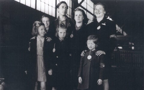 The seven Weber siblings upon their arrival at New York Harbor in May 1946. Bottom row from left: Renee, Judith, and Bela. Top row from left: Gertrude, Alfons, Senta, and Ruth. (Courtesy of United States Holocaust Memorial Museum)