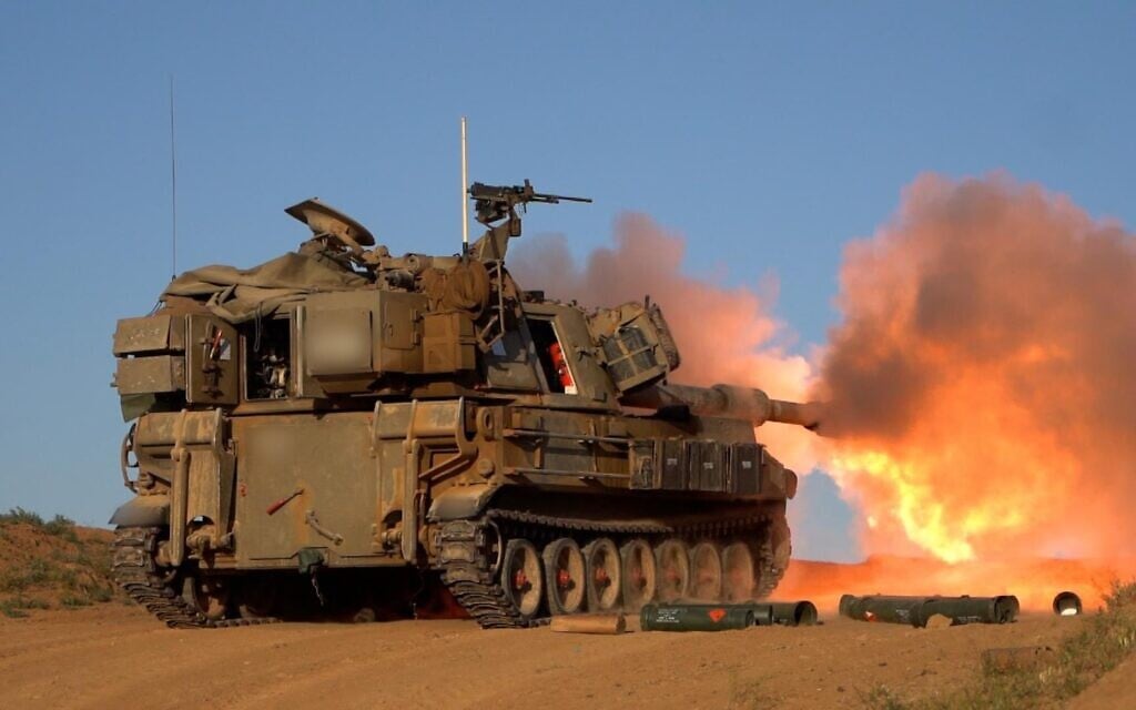 An IDF M109 howitzer of the 282nd Artillery Regiment is seen firing into the southern Gaza Strip, in a handout photo published by the military on April 19, 2025. (Israel Defense Forces)
