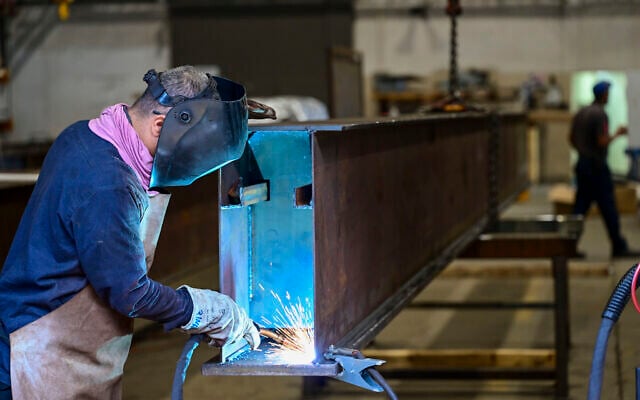 Illustrative: A worker in a factory near Afula, October 14, 2024 (Michael Giladi/Flash90)