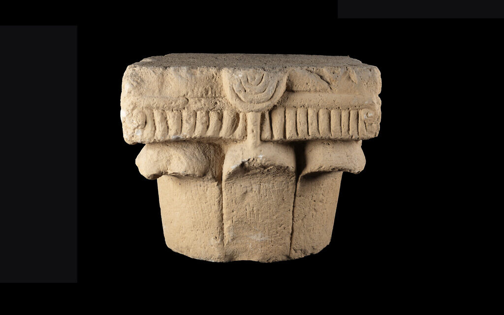 A capital decorated with menorahs dating to the 2nd-4th centuries CE has been uncovered in the Motza neighborhood in Jerusalem, the Israel Antiquities Authority announced on April 29, 2025. (Arkady Ostrovsky/Israel Antiquities Authority)