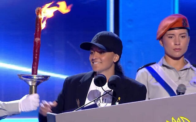 Released hostage Emily Damari lights a torch at the prerecorded opening event of Israel's 77th Independence Day, broadcast on April 30, 2025 (Screenshot)