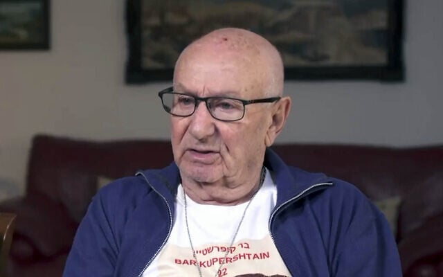 Michael Kupershtein, a Holocaust survivor and the grandfather of hostage Bar Kupershtein, in a TV interview in February 2024. (Kan news/screenshot)