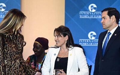 Amit Soussana (C), attorney and Israeli hostage survivor of the October 7, 2023, attack by Hamas, is honored by US Secretary of State Marco Rubio (R) and First Lady Melania Trump (L) during the International Women of Courage Awards Ceremony at the State Department in Washington, DC, on April 1, 2025. (Brendan SMIALOWSKI / AFP)