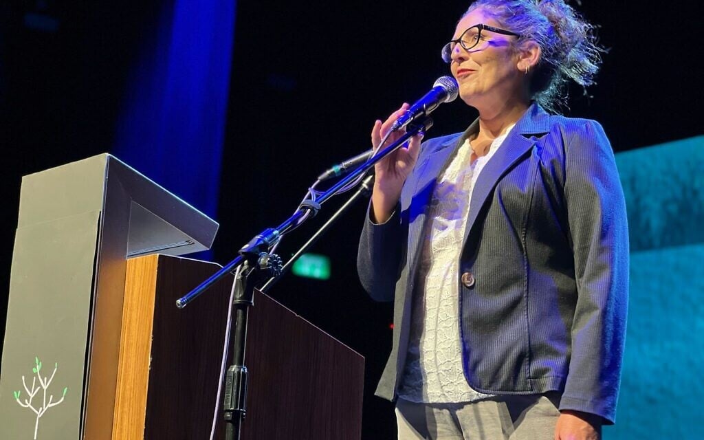 Liat Atzili, whose husband was killed in the October 7, 2023, massacre in Nir Oz, speaks at a joint Israeli-Palestinian Memorial Day ceremony in Jaffa, on April 29, 2025. (Gili Getz)