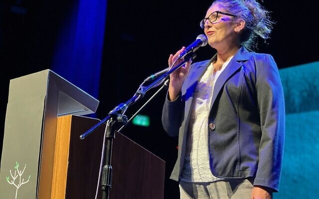 Liat Atzili, whose husband was killed in the October 7, 2023, massacre in Nir Oz, speaks at a joint Israeli-Palestinian Memorial Day ceremony in Jaffa, on April 29, 2025. (Gili Getz)