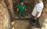 Prof. Jacob Ashkenazi from the Kinneret College on the Sea of Galilee as he cleans an inscription found in Horvat Hesheq, between Carmiel and Maalot, in 2018. (Prof. Jacob Ashkenazi)