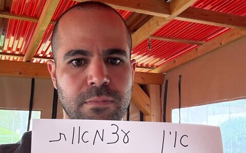 Yarden Bibas holds a sign declaring that 'I have no independence' due to there still being 59 hostages held in Gaza, days before Independence Day, in a post published on April 28, 2025. (Yarden Bibas/Instagram)