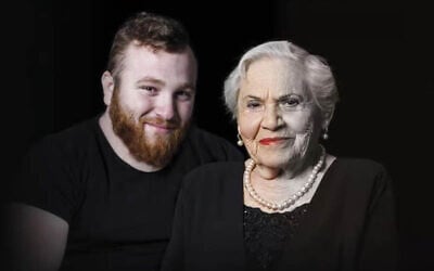 Asaf Cafri (left), an IDF reservist who was killed in Gaza on April 25, 2025 and his great-grandmother, Holocuast survivor Magda Baratz, pictured in a billboard set up in Rishon LeZion in honor of Holocaust Remembrace Day, the day before his death. (Oren Dai/Rishon LeZion Municipality)