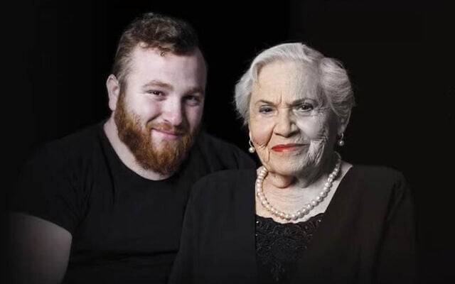 Asaf Cafri (left), an IDF reservist who was killed in Gaza on April 25, 2025 and his great-grandmother, Holocuast survivor Magda Baratz, pictured in a billboard set up in Rishon LeZion in honor of Holocaust Remembrace Day, the day before his death. (Oren Dai/Rishon LeZion Municipality)