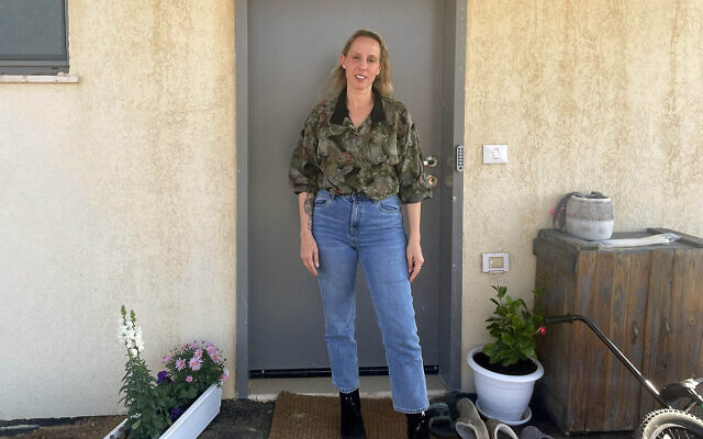 Artist Sofie Berzon Mackie at her new temporary home in Kibbutz Hatzerim, March 2025, after being evacuated from Kibbutz Be'eri on October 7, 2023 and living in a Dead Sea hotel for months with her partner and three children (Jessica Steinberg/Times of Israel)
