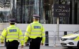 Illustrative: Police officers patrol in front of Scotland Yard, central London, on February 14, 2022. (Tolga Akmen / AFP)