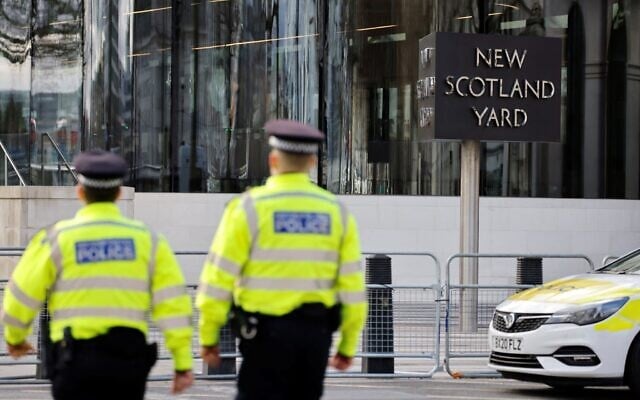 Illustrative: Police officers patrol in front of Scotland Yard, central London, on February 14, 2022. (Tolga Akmen / AFP) Illustrative: Police officers patrol in front of Scotland Yard, central London, on February 14, 2022. (Tolga Akmen / AFP)