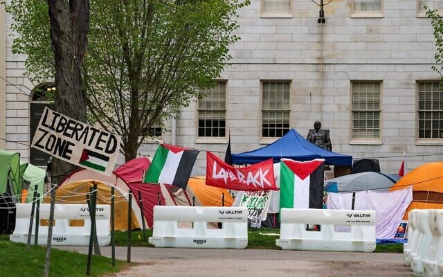 Tents and signs fill Harvard Yard by the John Harvard statue in the pro-Palestinian, anti-Israel encampment at Harvard University in Cambridge, Massachusetts, on May 5, 2024. (Joseph Prezioso / AFP)