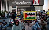 Supporters of Islami Jamiat-e-Talaba (IJT), a student wing of Pakistan's Jamaat-e-Islami (JI) party stage a pro-Palestinian and anti-Israel protest outside a Kentucky Fried Chicken (KFC) restaurant calling for boycott of Israeli products on the outskirts of Islamabad on May 7, 2024. (Farooq Naeem/AFP)