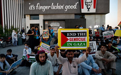 Supporters of Islami Jamiat-e-Talaba (IJT), a student wing of Pakistan's Jamaat-e-Islami (JI) party stage a pro-Palestinian and anti-Israel protest outside a Kentucky Fried Chicken (KFC) restaurant calling for boycott of Israeli products on the outskirts of Islamabad on May 7, 2024. (Farooq Naeem/AFP)