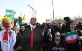 Iranians carry an effigy of US President Donald Trump during gathering to mark the 46th anniversary of the Islamic Revolution in front of the Azadi Tower in Tehran on February 10, 2025. (Photo by AFP)