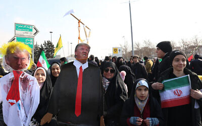 Iranians carry an effigy of US President Donald Trump during gathering to mark the 46th anniversary of the Islamic Revolution in front of the Azadi Tower in Tehran on February 10, 2025. (Photo by AFP)