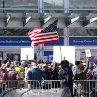 Demonstrators protest funding cuts outside of the National Institutes of Health (NIH) in Bethesda, Maryland, on March 8, 2025. (Michael Mathes / AFP)