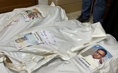Bodies of Palestinian first responders who were killed March 23, 2025, in Israeli military fire on ambulances lie at Nasser Medical Complex in Khan Yunis in the southern Gaza Strip on March 30, 2025. (AFP)
