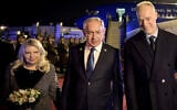 Israeli Prime Minister Benjamin Netanyahu and his wife Sara Netanyahu are welcomed by Hungary's Defense Minister Kristóf Szalay-Bobrovniczky (R) on April 3, 2025 at the airport in Budapest, (Sztaniszlav Horvath/ Hungarian Defense Ministry / AFP)