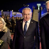 Israeli Prime Minister Benjamin Netanyahu and his wife Sara Netanyahu are welcomed by Hungary's Defense Minister Kristóf Szalay-Bobrovniczky (R) on April 3, 2025 at the airport in Budapest, (Sztaniszlav Horvath/ Hungarian Defense Ministry / AFP)