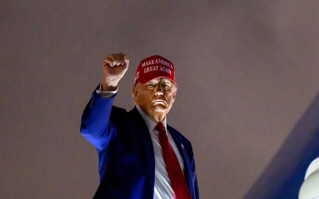 US President Donald Trump pumps his fist as he boards Air Force One before departing Miami International Airport, in Miami, Florida on April 3, 2025. Trump is travelling to his Mar-a-Lago Resort. (Mandel NGAN / AFP) US President Donald Trump pumps his fist as he boards Air Force One before departing Miami International Airport, in Miami, Florida on April 3, 2025. Trump is travelling to his Mar-a-Lago Resort. (Mandel NGAN / AFP)