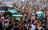 Mourners carry the caskets of slain Hamas terror group commander Hassan Farhat (C), his son Hamza (R) and daughter Jenan (L), who were killed in an Israeli drone strike that targeted their apartment in the southern Lebanese city of Sidon, during their funeral procession on April 4, 2025. (Mahmoud ZAYYAT / AFP)