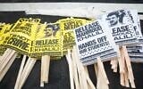 Signs in support of detained graduate student Mahmoud Khalil are readied during the nationwide "Hands Off!" protest against US President Donald Trump and Tesla CEO Elon Musk, in Washington, on April 5, 2025. (Amid Farahi/AFP)