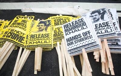Signs in support of detained graduate student Mahmoud Khalil are readied during the nationwide "Hands Off!" protest against US President Donald Trump and Tesla CEO Elon Musk, in Washington, on April 5, 2025. (Amid Farahi/AFP)