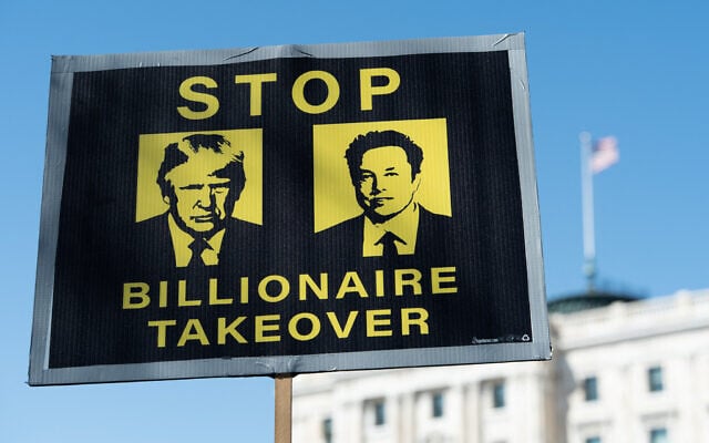 Demonstrators gather outside the Minnesota State Capitol during the nationwide "Hands Off!" protest against US President Donald Trump and his advisor, Tesla CEO Elon Musk, in St. Paul, Minnesota, on April 5, 2025. (Photo by Tim Evans / AFP)