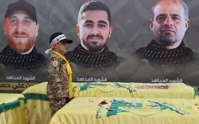 A boy attends the funeral of Hezbollah fighters, killed before the November 27 ceasefire with Israel, in southern Lebanese village of Taybeh, Lebanon on April 6, 2025. (Photo by Rabih DAHER / AFP)