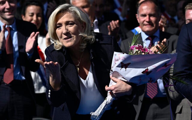 French far-right politician Marine Le Pen gestures after delivering a speech during a rally in her support in Paris on April 6, 2025. (JULIEN DE ROSA / AFP) French far-right politician Marine Le Pen gestures after delivering a speech during a rally in her support in Paris on April 6, 2025. (JULIEN DE ROSA / AFP)