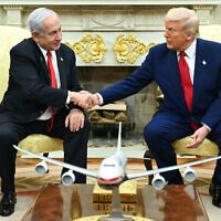 US President Donald Trump shakes hands with Prime Minister Benjamin Netanyahu during a meeting in the Oval Office of the White House in Washington, DC, on April 7, 2025. (SAUL LOEB / AFP)