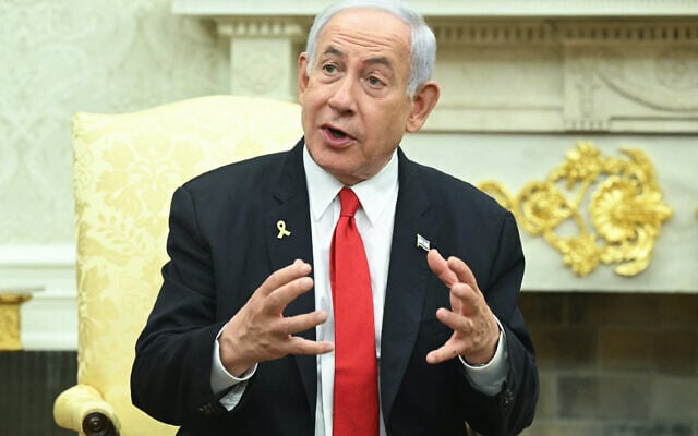Prime Minister Benjamin Netanyahu speaks during a meeting with US President Donald Trump in the Oval Office of the White House in Washington, DC, on April 7, 2025. (SAUL LOEB / AFP)