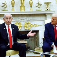 Prime Minister Benjamin Netanyahu, left, speaks alongside US President Donald Trump during a meeting in the Oval Office of the White House  in Washington, DC, on April 7, 2025. (Kevin Dietsch / Getty Images via AFP)