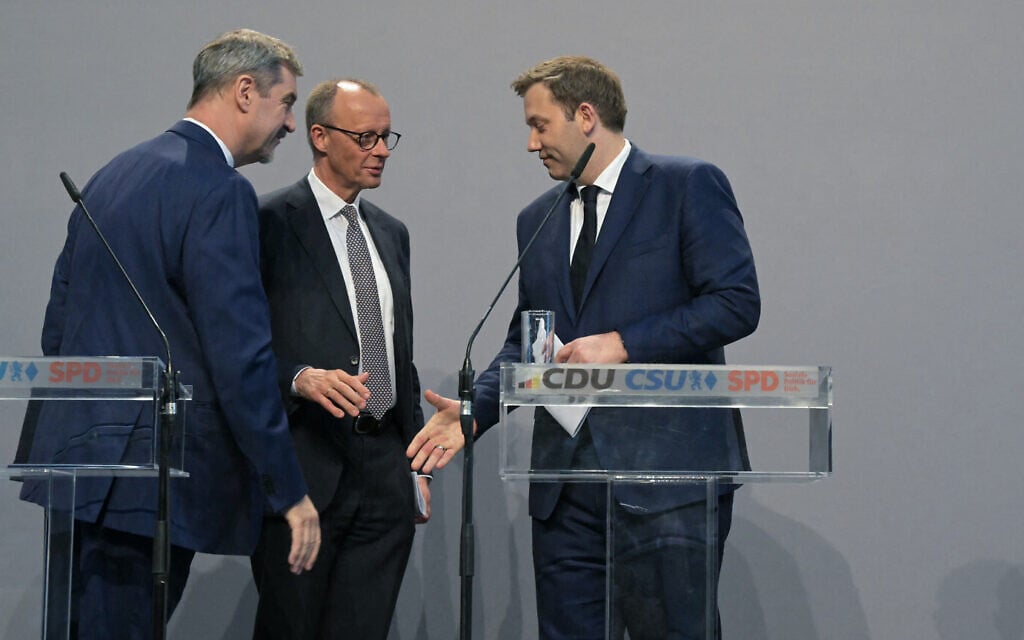 Christian Social Union leader Markus Soeder, left, Christian Democratic Union head Friedrich Merz, center and Social Democratic party co-leader Lars Klingbeil leave a press conference in Berlin on April 9, 2025. (Tobias SCHWARZ / AFP) Christian Social Union leader Markus Soeder, left, Christian Democratic Union head Friedrich Merz, center and Social Democratic party co-leader Lars Klingbeil leave a press conference in Berlin on April 9, 2025. (Tobias SCHWARZ / AFP)